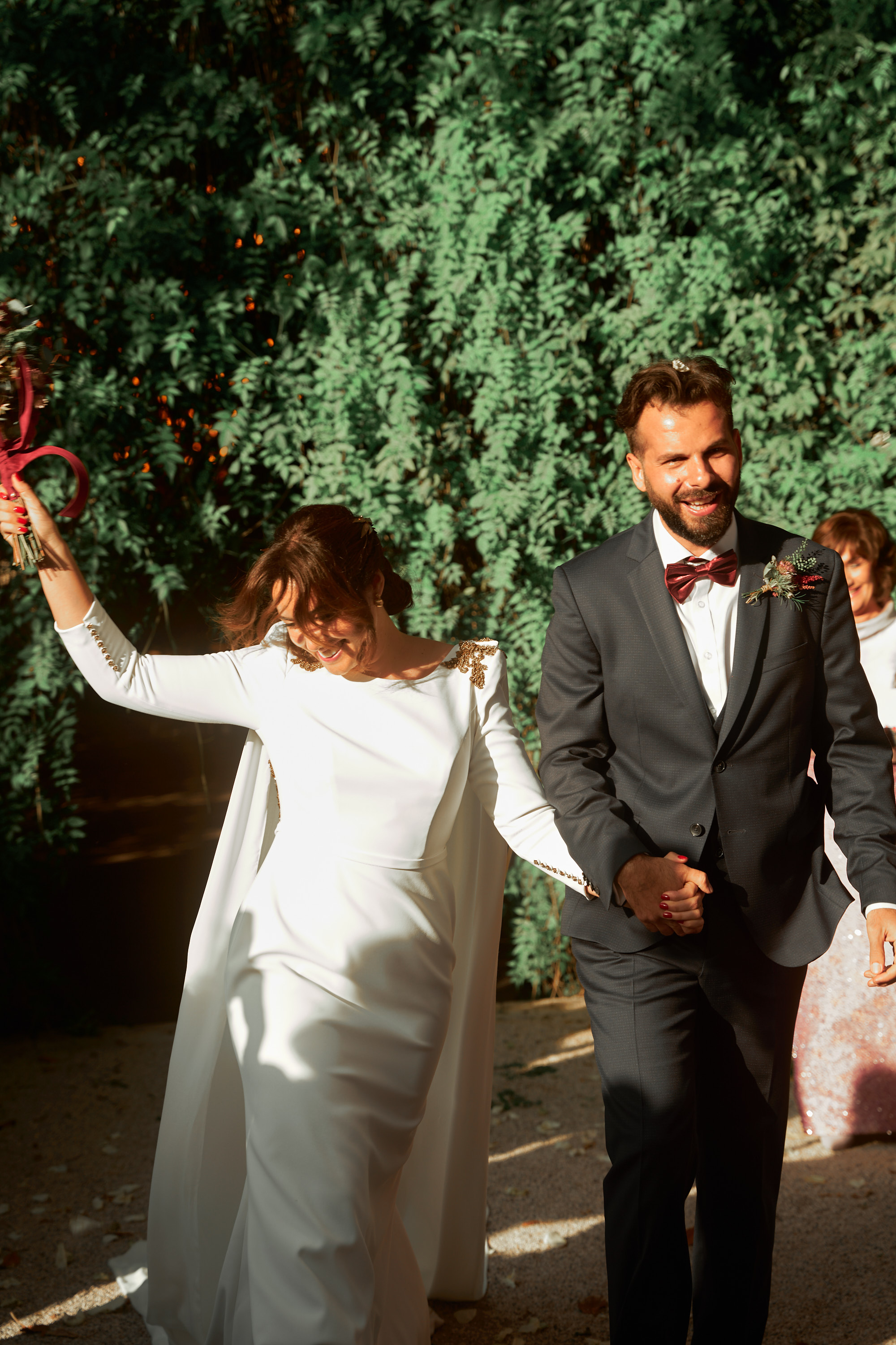 Bride and groom walking hand in hand